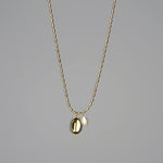 Tuotekuva kullatusta kaulakorusta, jossa yksittäinen helmi