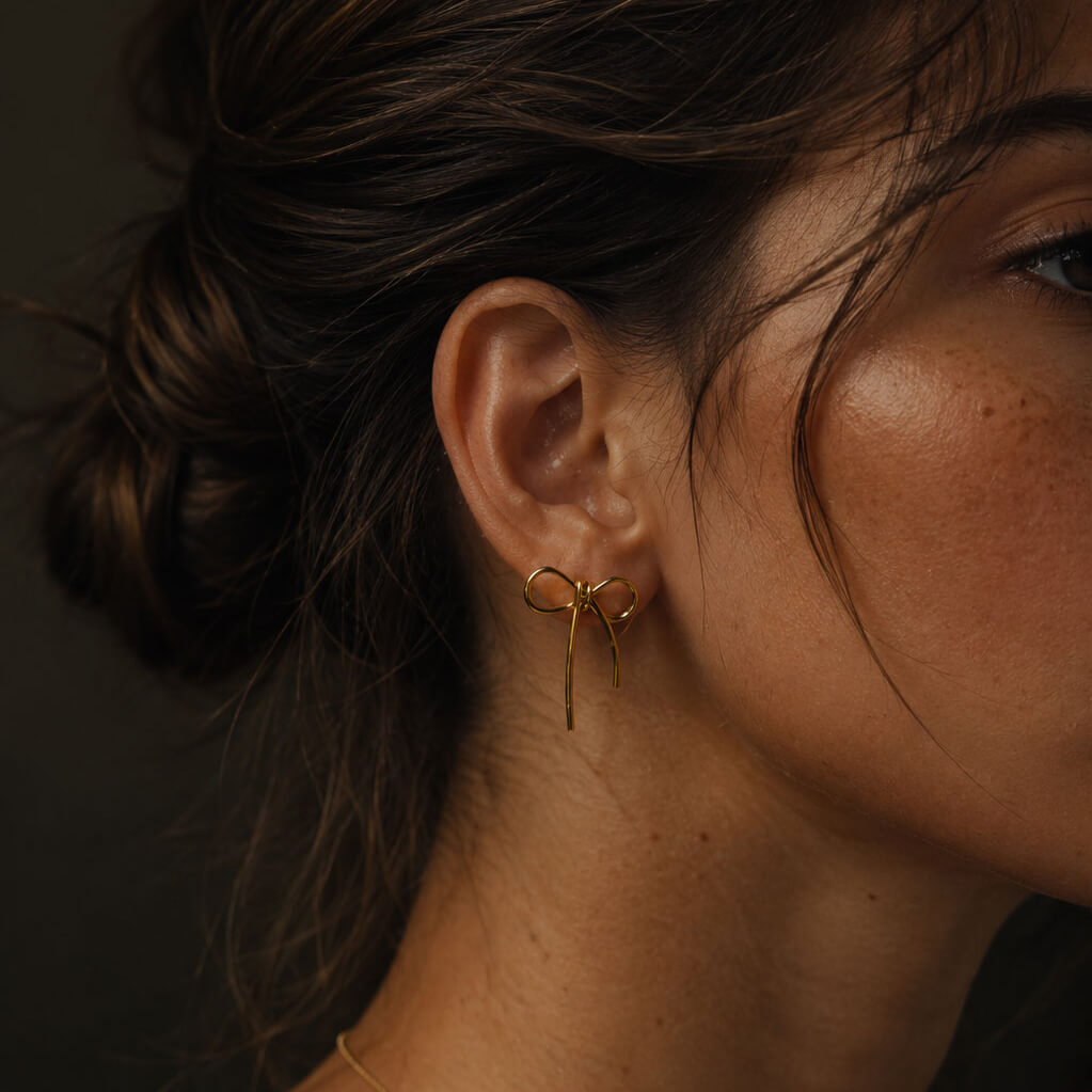 madoww Bow waterproof bow earrings in 18k PVD gold-plated stainless steel worn on ear