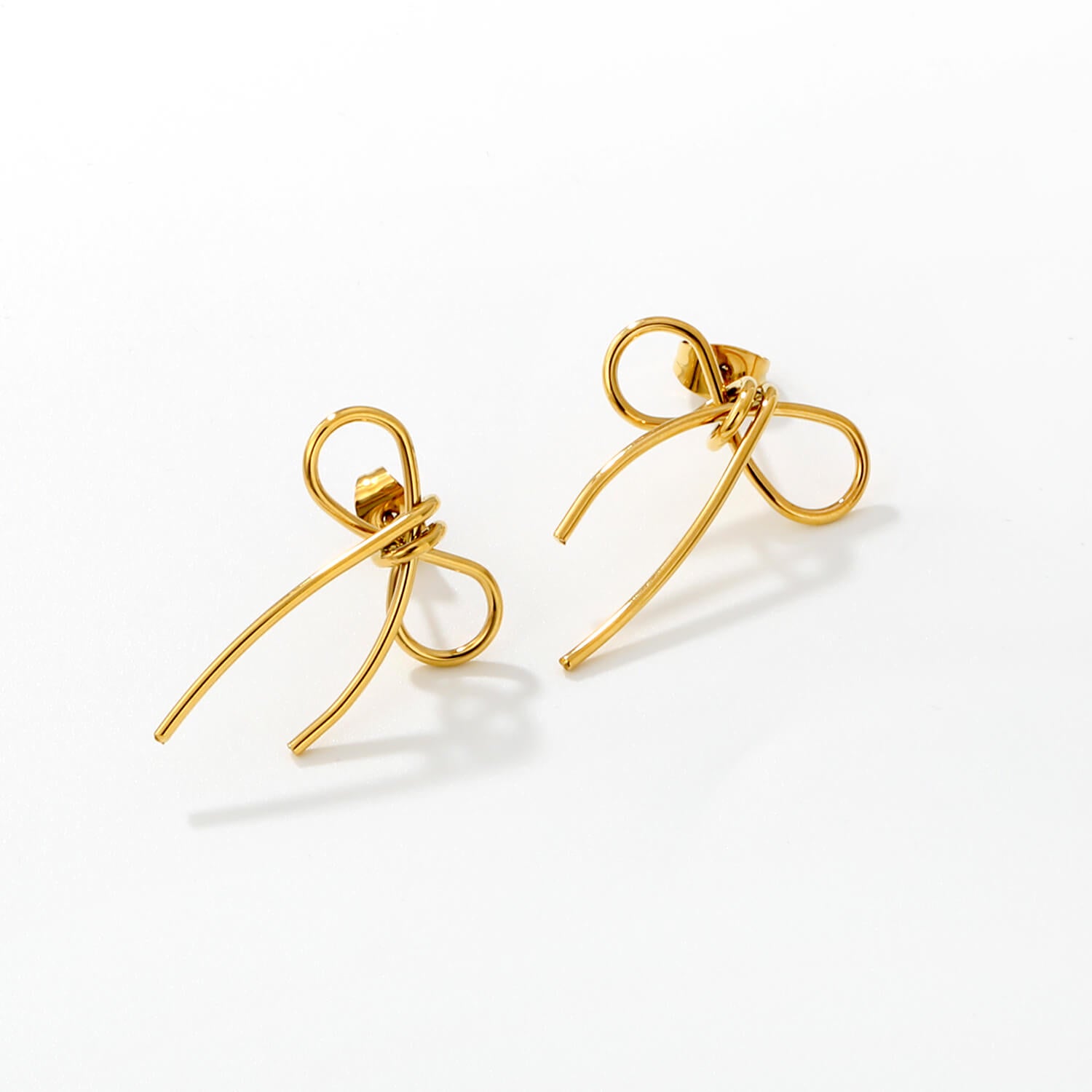 madoww Bow waterproof bow earrings in 18k PVD gold-plated skin-friendly stainless steel on a white background