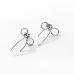 madoww Bow waterproof bow earrings in silver skin-friendly stainless steel on a white background