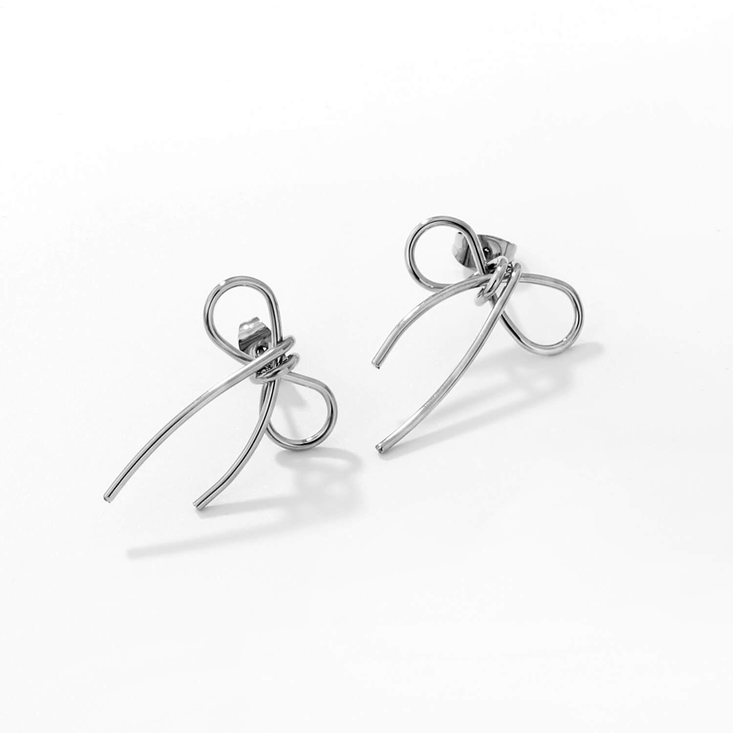 madoww Bow waterproof bow earrings in silver skin-friendly stainless steel on a white background