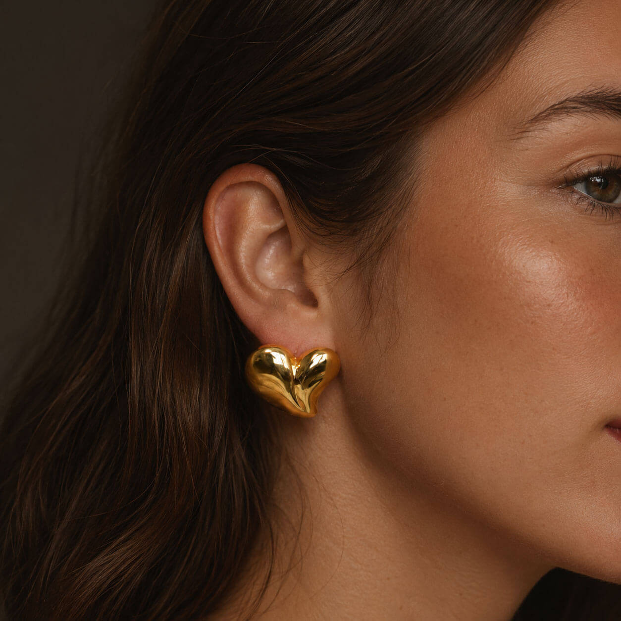 Heart earring, PVD 18K gold-plated heart-shaped stainless steel earring shown in a side-profile close-up.