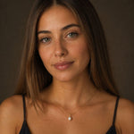 waterproof single pearl gold necklace on a young woman